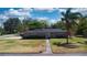 Beautiful single-story home boasting a well-maintained lawn, picturesque landscaping, and a welcoming facade at 1195 E George St, Bartow, FL 33830