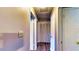 Well-lit hallway featuring wood-look floors and access to various rooms and closet space at 1195 E George St, Bartow, FL 33830