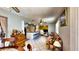 Open-concept living space with dining area, kitchen bar, and cozy seating at 1195 E George St, Bartow, FL 33830