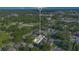 An aerial view shows property in a residential neighborhood near a park and retail stores at 1210 Marrick Cir, Lakeland, FL 33815