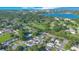 Neighborhood aerial view showcasing the property's proximity to a scenic lake and lush green surroundings at 1210 Marrick Cir, Lakeland, FL 33815