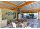 Covered patio featuring outdoor seating and a dining area with outdoor kitchen at 1210 Marrick Cir, Lakeland, FL 33815