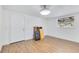 Bright room featuring light hardwood floors, a window, and a white door at 1210 Marrick Cir, Lakeland, FL 33815