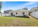 Fully fenced backyard with a patio area, providing privacy and space for outdoor activities at 1216 Myopia Hunt Club Dr, Auburndale, FL 33823