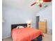 Bedroom with a ceiling fan, dresser, and neutral carpet at 1216 Myopia Hunt Club Dr, Auburndale, FL 33823