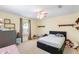 Bedroom featuring a ceiling fan, window, and wood-look floating shelves at 1216 Myopia Hunt Club Dr, Auburndale, FL 33823