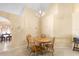 Dining room featuring wooden table and chairs, neutral walls, and views into adjoining rooms at 1216 Myopia Hunt Club Dr, Auburndale, FL 33823