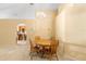 Cozy dining room area with wood table set, chandelier lighting and neutral color scheme at 1216 Myopia Hunt Club Dr, Auburndale, FL 33823
