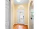 Welcoming foyer features a decorative front door, hardwood floors, and an arched entryway at 1216 Myopia Hunt Club Dr, Auburndale, FL 33823