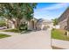 Well-maintained single Gathering home with a large driveway and mature landscaping in a quiet neighborhood at 1216 Myopia Hunt Club Dr, Auburndale, FL 33823