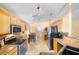 Modern kitchen features granite countertops, stainless steel appliances, and tile backsplash at 1216 Myopia Hunt Club Dr, Auburndale, FL 33823