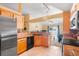 Open kitchen showcasing modern appliances, granite countertops, and a seamless transition to the living area at 1216 Myopia Hunt Club Dr, Auburndale, FL 33823