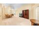 Large living space that includes a dining area, a bookcase, and neutral-colored carpet at 1216 Myopia Hunt Club Dr, Auburndale, FL 33823