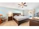 Spacious main bedroom with ceiling fan, carpet flooring, and natural light at 1216 Myopia Hunt Club Dr, Auburndale, FL 33823