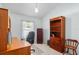 Bright office space features a wood desk, filing cabinet, and built-in bookshelf at 1216 Myopia Hunt Club Dr, Auburndale, FL 33823