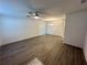 Spacious living room with ceiling fan and wooden floors with bright light at 1253 Dosseywood Ln, Lakeland, FL 33811