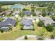 Aerial view of neighborhood with golf course and lake at 1295 Osprey Landing Dr, Lakeland, FL 33813