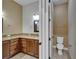 Bathroom featuring double sinks with granite countertops and separate toilet room at 1295 Osprey Landing Dr, Lakeland, FL 33813