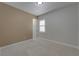 Bedroom featuring neutral walls, carpet, and a window with shutter at 1295 Osprey Landing Dr, Lakeland, FL 33813