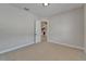 Bright bedroom featuring carpet, neutral paint, and an open doorway to living area at 1295 Osprey Landing Dr, Lakeland, FL 33813