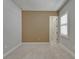 Bedroom with neutral walls, carpet, and a door leading to a closet at 1295 Osprey Landing Dr, Lakeland, FL 33813