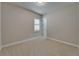 Bedroom with neutral walls, carpet, and a window with shutter at 1295 Osprey Landing Dr, Lakeland, FL 33813