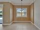 Dining room with chandelier and window view of the pool and backyard at 1295 Osprey Landing Dr, Lakeland, FL 33813