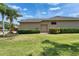 Lush landscaping surrounds the house with a single car garage at 1295 Osprey Landing Dr, Lakeland, FL 33813