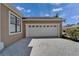 Two car garage and wide driveway paved with brick at 1295 Osprey Landing Dr, Lakeland, FL 33813