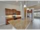 Gourmet kitchen with granite countertops, stainless steel appliances, and ample cabinet space for storage at 1295 Osprey Landing Dr, Lakeland, FL 33813