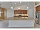 Bright kitchen featuring granite counters, stainless steel appliances and hanging pendant lights at 1295 Osprey Landing Dr, Lakeland, FL 33813