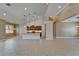 Expansive living space showing tile flooring, recessed lighting, and an open connection to the kitchen area at 1295 Osprey Landing Dr, Lakeland, FL 33813