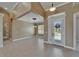 Open floorplan with high ceilings, transom window, and double doors to the front, creating an airy atmosphere at 1295 Osprey Landing Dr, Lakeland, FL 33813