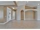Spacious living room showcasing neutral walls, tile floors, and archways at 1295 Osprey Landing Dr, Lakeland, FL 33813