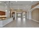 Great room featuring tile floors, high ceilings, and modern lighting with an island overlooking the kitchen at 1295 Osprey Landing Dr, Lakeland, FL 33813