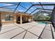 Covered patio with large deck leads to screened pool with golf course views at 1295 Osprey Landing Dr, Lakeland, FL 33813