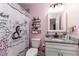 Bathroom features a granite countertop, decorative shower curtain, and modern fixtures at 1297 Pintail Pl, Lakeland, FL 33813