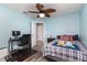 Comfortable bedroom with a ceiling fan, wood-look floors, and a relaxing atmosphere at 1297 Pintail Pl, Lakeland, FL 33813