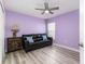 Sitting room with wood-look floors and a comfortable leather couch at 1297 Pintail Pl, Lakeland, FL 33813