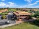 Aerial view of community clubhouse and golf course with stunning landscaping at 1394 Oakmont Dr, Winter Haven, FL 33884