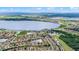 Expansive aerial shot showcases homes and golf courses in this lakeside community in a serene natural setting at 1394 Oakmont Dr, Winter Haven, FL 33884
