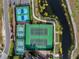 An aerial view of the community tennis courts and lovely landscaping at 1394 Oakmont Dr, Winter Haven, FL 33884