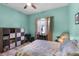 Inviting bedroom with neutral curtains, ceiling fan, and cube storage, perfect for restful nights and organization at 1394 Oakmont Dr, Winter Haven, FL 33884