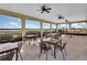 Spacious outdoor dining area featuring lovely lake views and plenty of seating at 1394 Oakmont Dr, Winter Haven, FL 33884