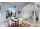 Elegant dining area featuring a large arched window and view of the front entrance at 1394 Oakmont Dr, Winter Haven, FL 33884