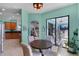 Bright dining area with a round table and chairs, offering views of the outdoor patio at 1394 Oakmont Dr, Winter Haven, FL 33884