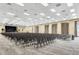 Spacious event hall featuring rows of chairs, a stage, and elegant drapery for a versatile venue at 1394 Oakmont Dr, Winter Haven, FL 33884