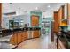 Modern kitchen with stainless steel appliances, breakfast bar, and ample cabinet space at 1394 Oakmont Dr, Winter Haven, FL 33884
