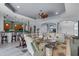 Open-concept living room with modern furnishings, adjacent to the kitchen and entryway at 1394 Oakmont Dr, Winter Haven, FL 33884