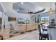 Bright living room with access to the patio and backyard, featuring a comfortable sofa and ample space at 1394 Oakmont Dr, Winter Haven, FL 33884